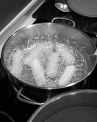 Traditional food tulumbas being fried in oil AM