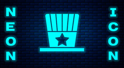 Glowing neon Patriotic American top hat icon isolated on brick wall background. Uncle Sam hat. American hat independence day. Vector.