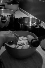 Dough in a blue bowl made for traditional food tulumbas in a kitchen AM