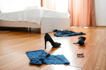 Female clothing on the hotel floor in the light room