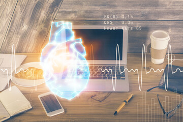 Desktop computer background and heart drawing. Double exposure. Medical study and healthcare concept.