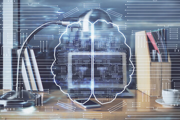 Multi exposure of work table with computer and brain hologram. Brainstorm concept.