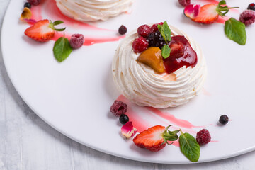 delicious cake with berries on a white plate