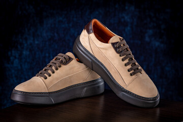 Brown men's lather shoes on blue background