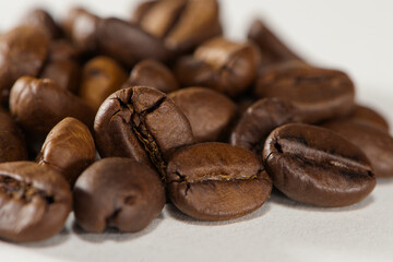
grains of black aromatic coffee close-up