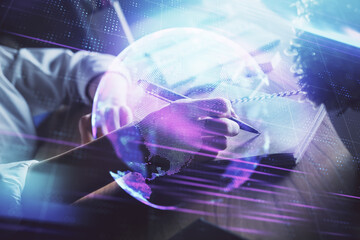 Tech theme hologram over woman's hands taking notes background. Concept of hightech. Double exposure