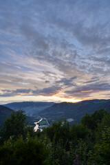 View over Gol, Norway. Beautiful sunset over the mountains. Shot from Liagardane, a place located...