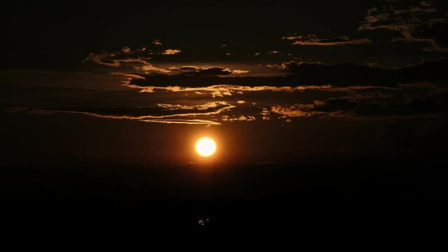 Time lapse of beautiful sunset. The sun goes down below the horizon. Red sunset, Dehradun city, Uttarakhand, India, 4K