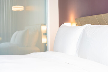 White color comfortable pillow and blanket on bed