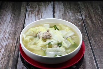 Traditional clear soup of Chinese cabbage and marinated (minced) pork in the bowl. Famous hot and freshness soup menu in Chinese restaurant. 