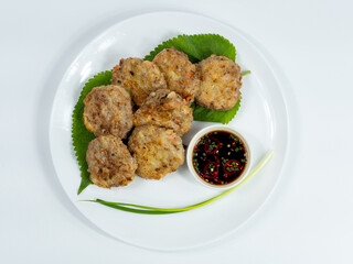 Korean food : Donjeonya(Donggeurangttaeng). A mixture of ground beef or pork and minced vegetables molded into round shapes, flour-coated, egg-battered, and pan-fried.