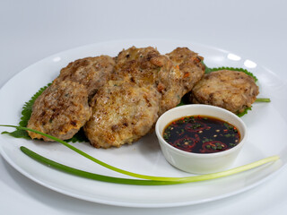 Korean food : Donjeonya(Donggeurangttaeng). A mixture of ground beef or pork and minced vegetables molded into round shapes, flour-coated, egg-battered, and pan-fried.