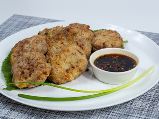 Korean food : Donjeonya(Donggeurangttaeng). A mixture of ground beef or pork and minced vegetables molded into round shapes, flour-coated, egg-battered, and pan-fried.