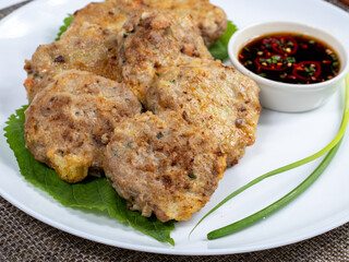 Korean food : Donjeonya(Donggeurangttaeng). A mixture of ground beef or pork and minced vegetables molded into round shapes, flour-coated, egg-battered, and pan-fried.