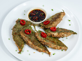 Korean food : Kkaennipjeon. Half-folded perilla leaves stuffed with a mixture of minced meat and vegetables, egg-battered, and pan-fried.  Korean ritual food usually eaten on holidays.