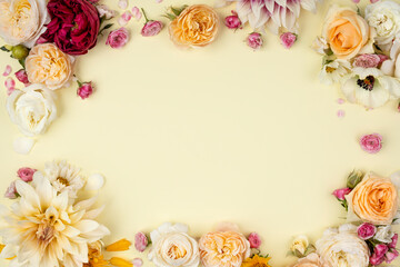 Fototapeta na wymiar Romantic heart made of a mix of fresh flowers. Colorful floral bloom inspired by special occasions. Wedding card emblazoned with flowers on a white background.
