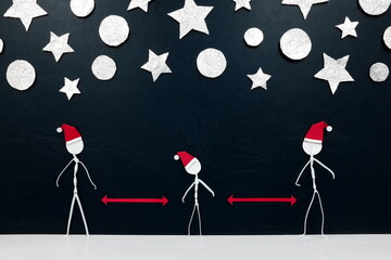 Fototapeta na wymiar Stick men figure wearing santa hat with red distance marker in between and silver stars and balls ornament background. Safe covid Christmas concept.