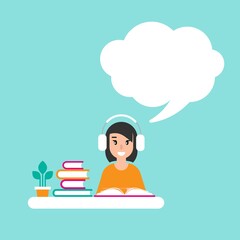 happy freelancer girl with earphones on desk with books. creative hipster work or study at home.