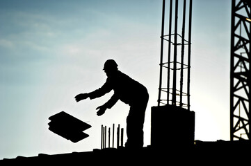 A silhouette of a construction worker