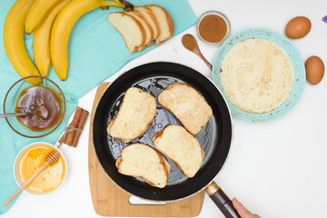 step by step recipe portioned French toast with banana and caramel homemade with cinnamon, dessert on a blue plate on a light background. ingredients for making homemade toast