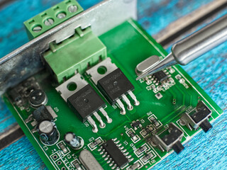 Damaged electronic board during repair with a soldering iron