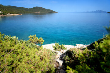 Beautiful Mediterranean landscape, beautiful clear water and pine trees on the shore. Travel to Turkey