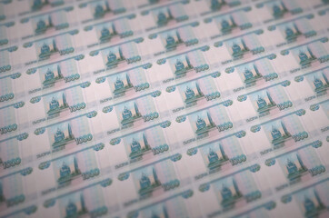 1000 russian rubles bills printed in illegal money production conveyor. Collage of many fake bills....