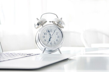 alarm clock and laptop