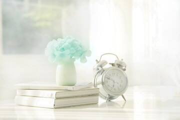 still life with clock and book