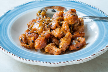 Fellah Koftesi Traditional Food. (Turkish cuisine) Polpettes From Bulgur or Bulghur and Semolina in Tomato Sauce with Parsley.