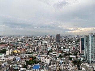 Fototapeta na wymiar Bangkok city skyline and rooftops from high view point