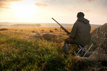 The man is on the hunt. Hunter with a hunting gun. Hunting for game birds.