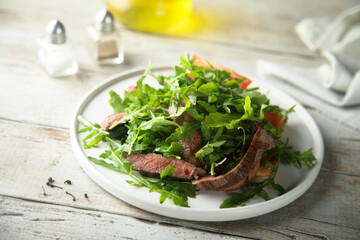 Arugula salad with grilled beef steak