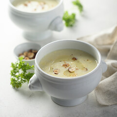 Homemade white asparagus soup with hazelnut