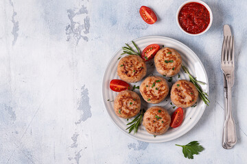 Fresh chiken cutlets with tomatoes and rosemary