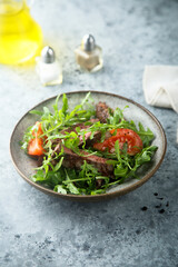 Arugula salad with grilled beef steak