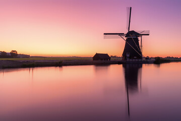 Dutch windmill just before sunrise