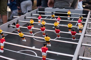 Table football game. Soccer table with red and yellow players.