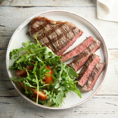 Grilled beef steak with green salad
