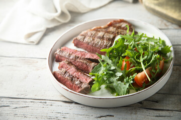 Grilled beef steak with green salad
