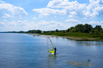 Windsurfing on the shore of the reservoir.