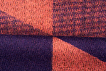 Close-up fragment of warm knitted printed sweatshirts. Concept of warm everyday things. clothing store concept. Advertising space. Place for text