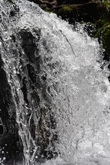 small waterfall crystalline water, very clear water in the waterfall