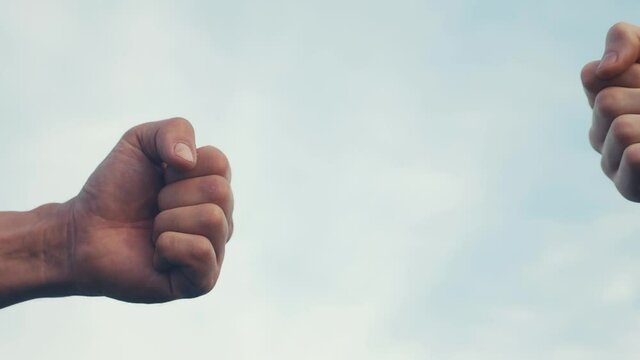 teamwork concept. fist to fist commit solidarity respect and brotherhood gesture. business team hands fists close-up. people of different skin colors lifestyle partnership friendship teamwork