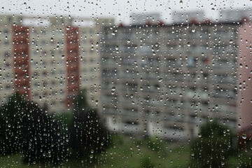 Courtyard in the rain seen through the rain drops