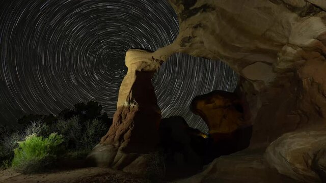 Rotating star trails in Metate Arch in Devils Garden, Utah 
