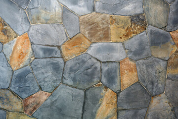 old stone or rock wall and vintage brown gray granite floor or black yellow jigsaw table for background or backdrop and wallpaper