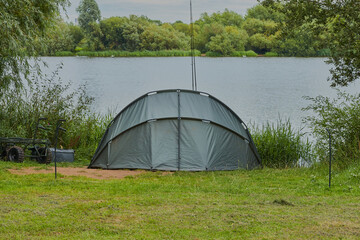 Fishing tent on a lake .