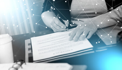 Naklejka premium Businesswoman signing a document; light effect