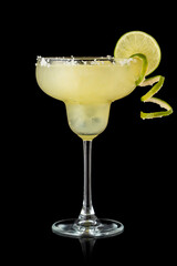 Lime margarita cocktail isolated on black background